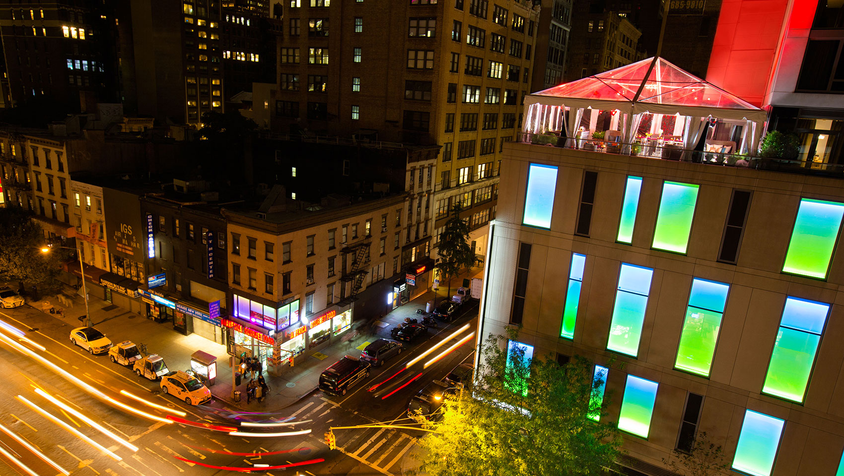 Veranda South tented wedding reception with tables shown from building exterior